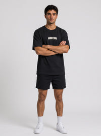 Ambition Limitless black organic cotton oversized t-shirt with drop shoulders and white logo print on chest