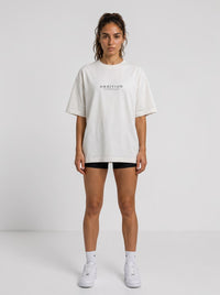 Ambition Limitless Legacy oversize off-white organic cotton t-shirt with dropped shoulders on a female model