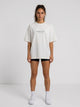 Ambition Limitless Legacy oversize off-white organic cotton t-shirt with dropped shoulders on a female model