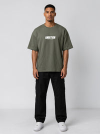 Ambition Limitless olive green organic cotton oversized t-shirt with drop shoulders and white chest logo