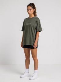 Ambition Limitless olive green heavyweight organic cotton oversized t-shirt with drop shoulders on a female model