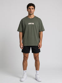 Ambition Limitless olive green organic cotton oversized t-shirt with dropped shoulders and white chest logo print