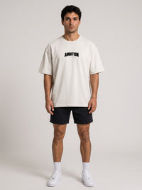 Ambition Limitless Origins oversize beige organic cotton t-shirt with drop shoulders and black logo on chest