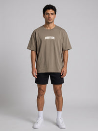 Ambition Limitless Origins oversize t-shirt in taupe organic cotton with drop shoulders and white chest logo print
