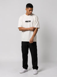 Ambition Limitless white oversized organic cotton t-shirt with black logo on chest worn by a male model